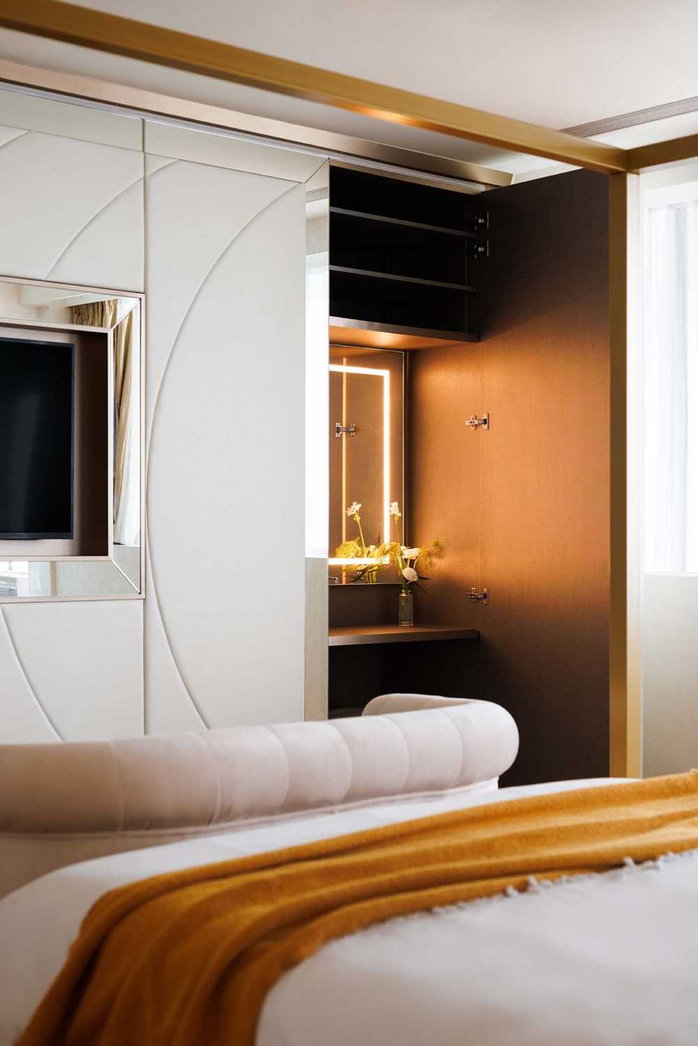 Contemporary Bedroom with Cove Lighting and Bed