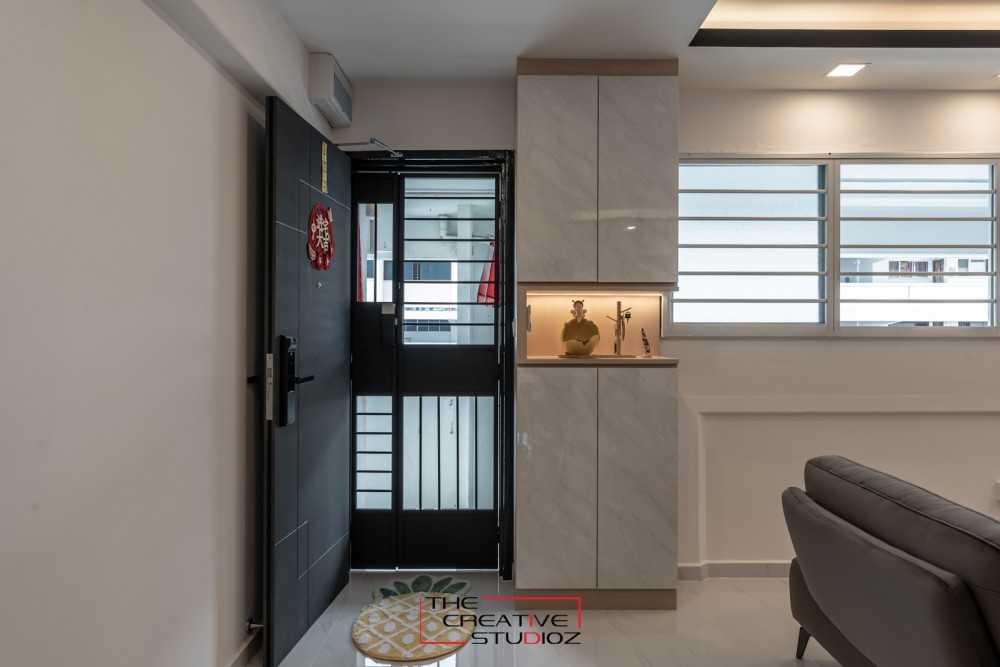 Modern Foyer with Cove Lighting and Shoe Cabinets