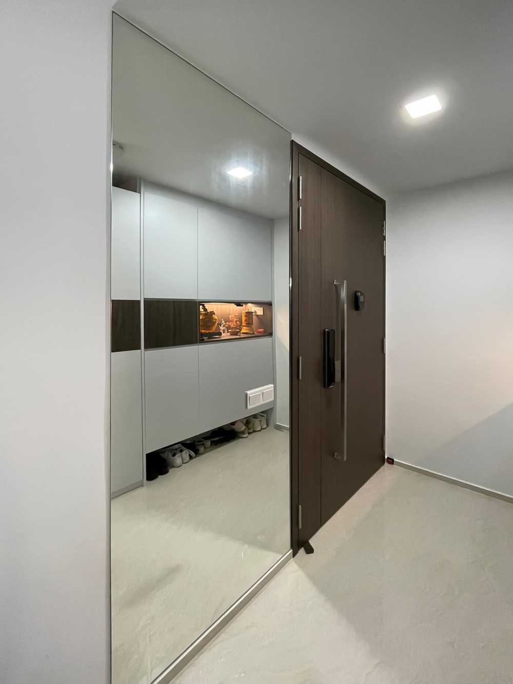 Scandinavian Foyer with Mirror and Paintings