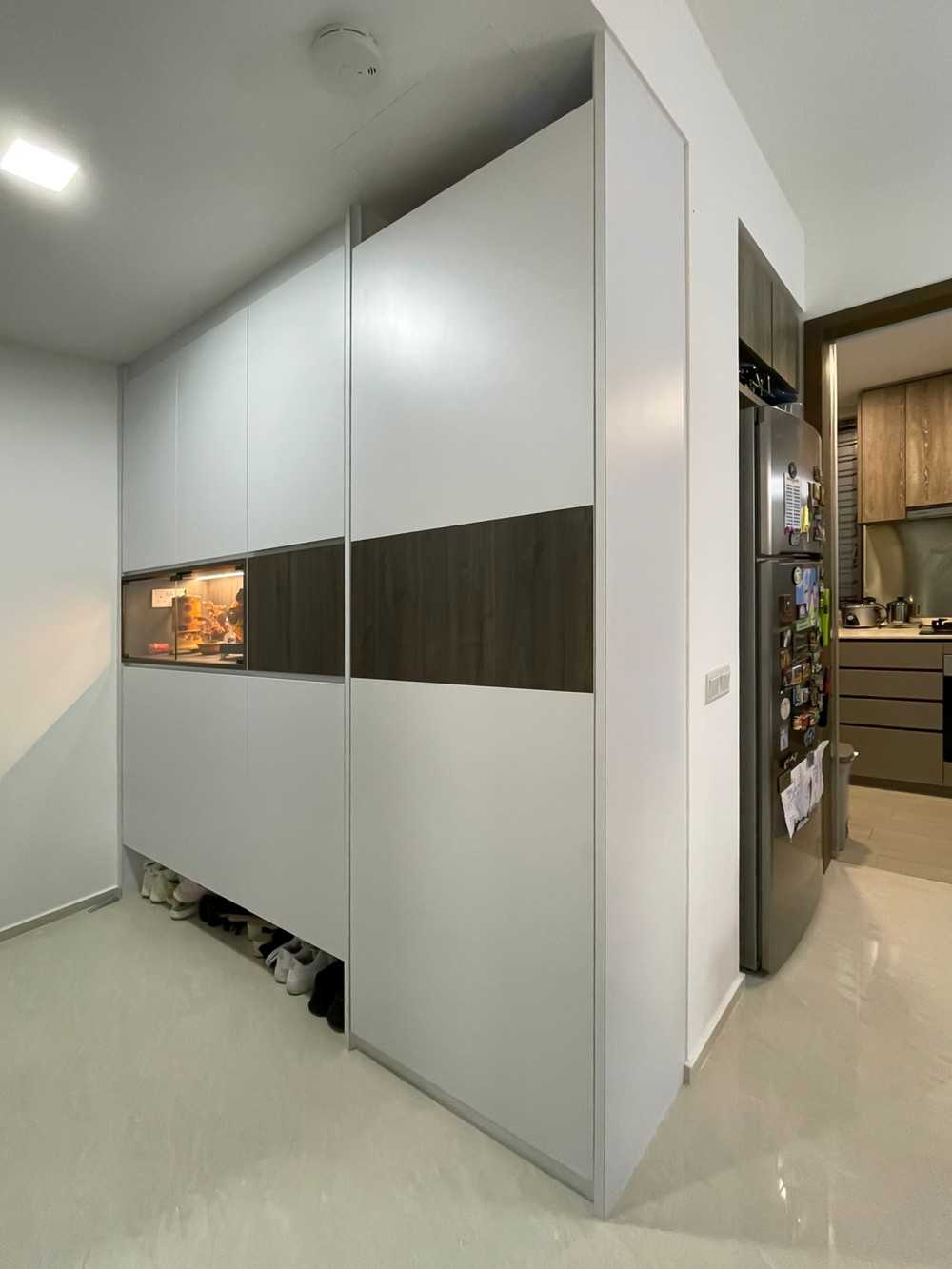 Scandinavian Foyer with Paintings and Storage Cabinets