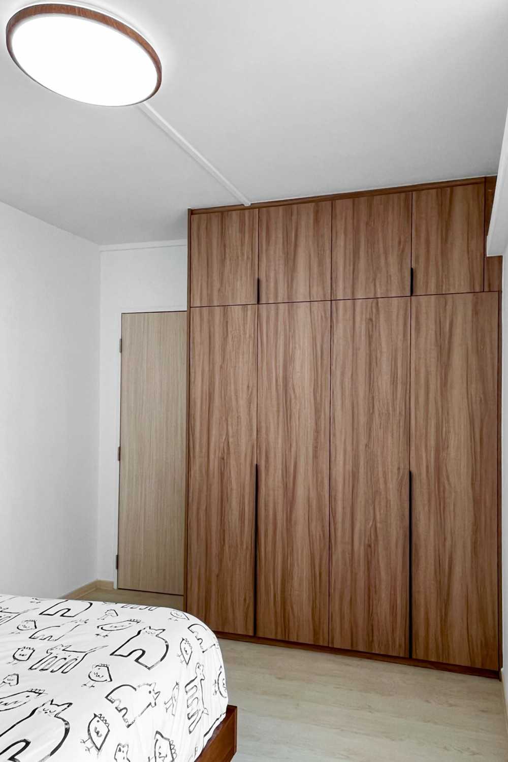 Minimalist Bedroom with Wardrobe and Children's Beds
