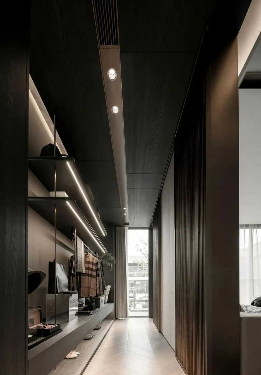 Contemporary Walk-in Wardrobe with Herringbone Tiling and Mirror