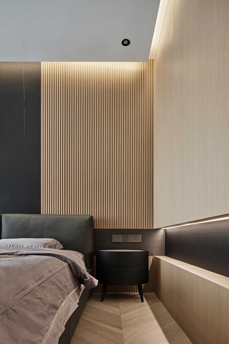 Contemporary Bedroom with Herringbone Tiling and Feature Wall