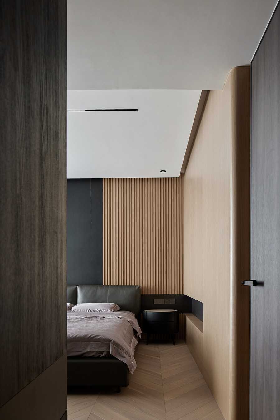 Contemporary Bedroom with Herringbone Tiling and Feature Wall
