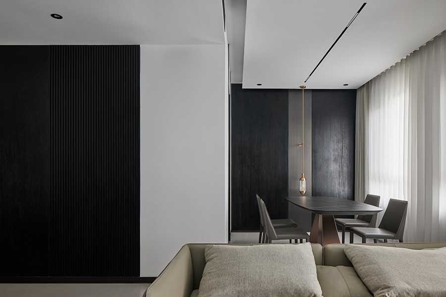 Contemporary Dining Room with Homogeneous Tiles and Feature Wall