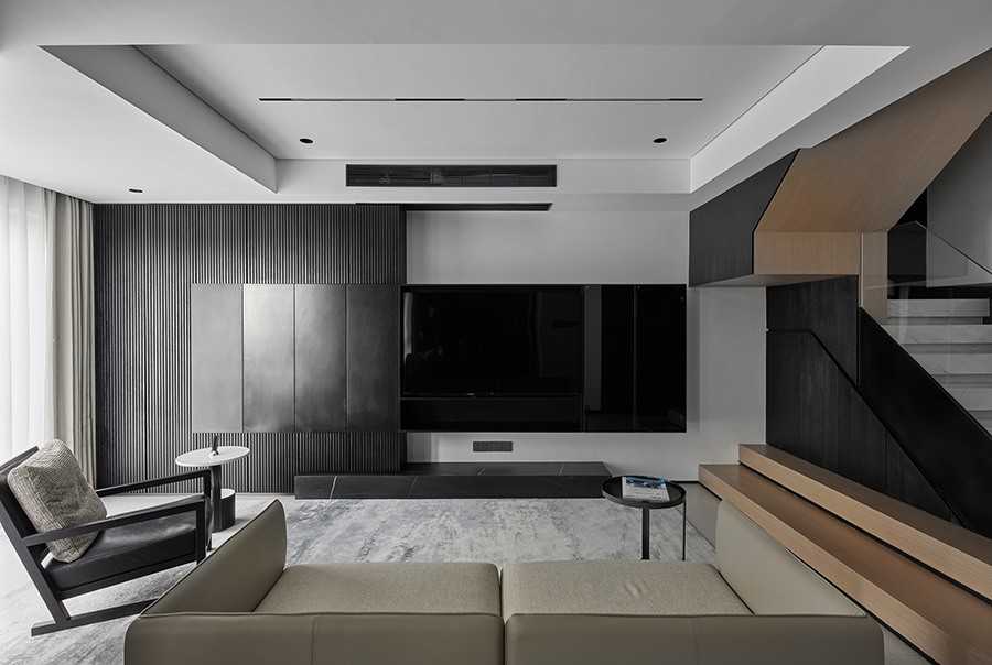 Contemporary Living Room with Homogeneous Tiles and Feature Wall