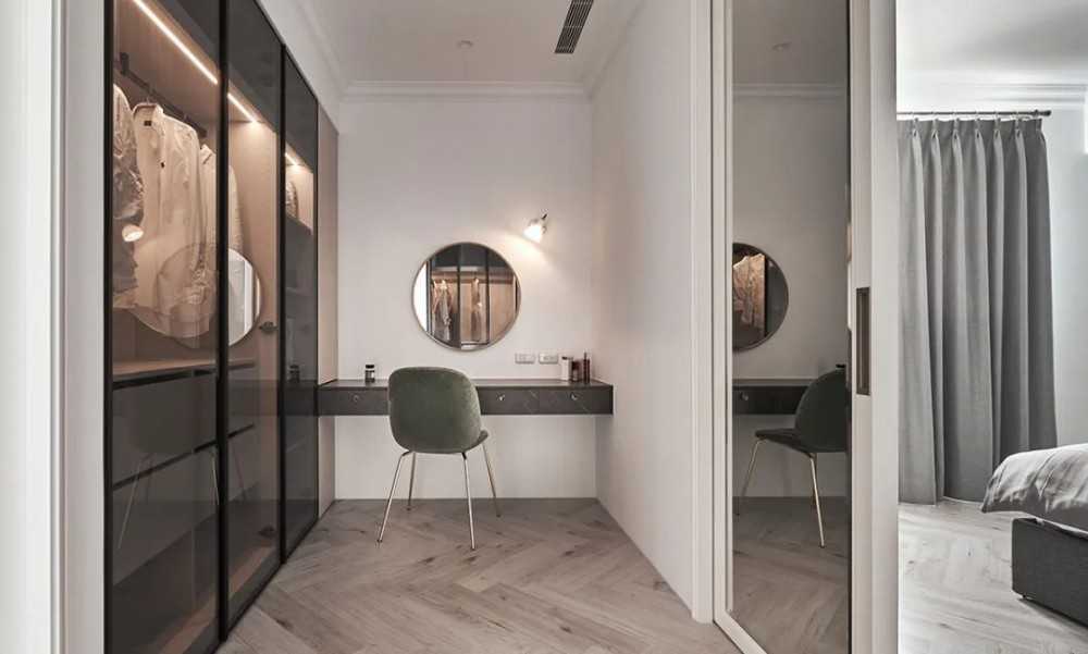 Contemporary Walk-in Wardrobe with Herringbone Tiling and Mirror
