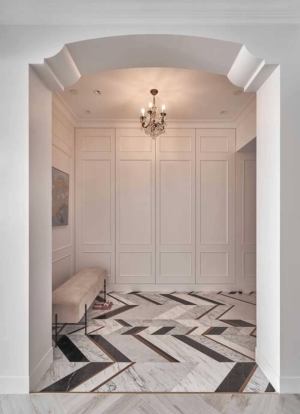 Contemporary Foyer with Herringbone Tiling and Feature Wall