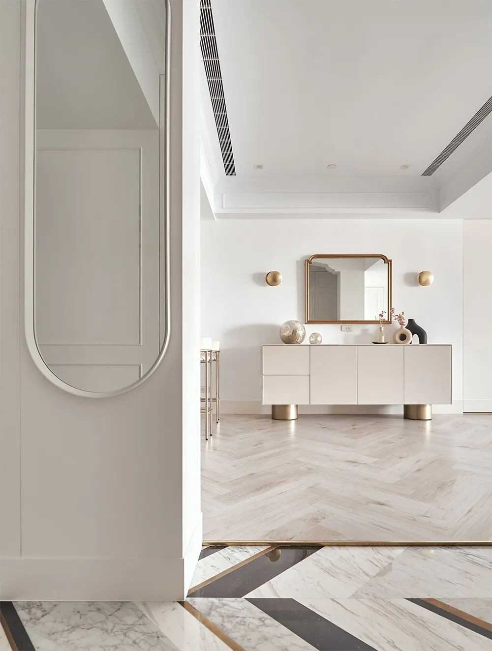 Contemporary Hallway with Herringbone Tiling and Mirror