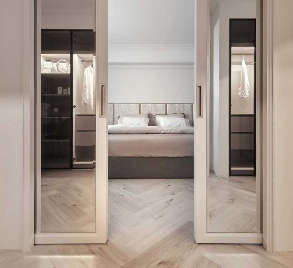 Contemporary Walk-in Wardrobe with Herringbone Tiling and Mirror