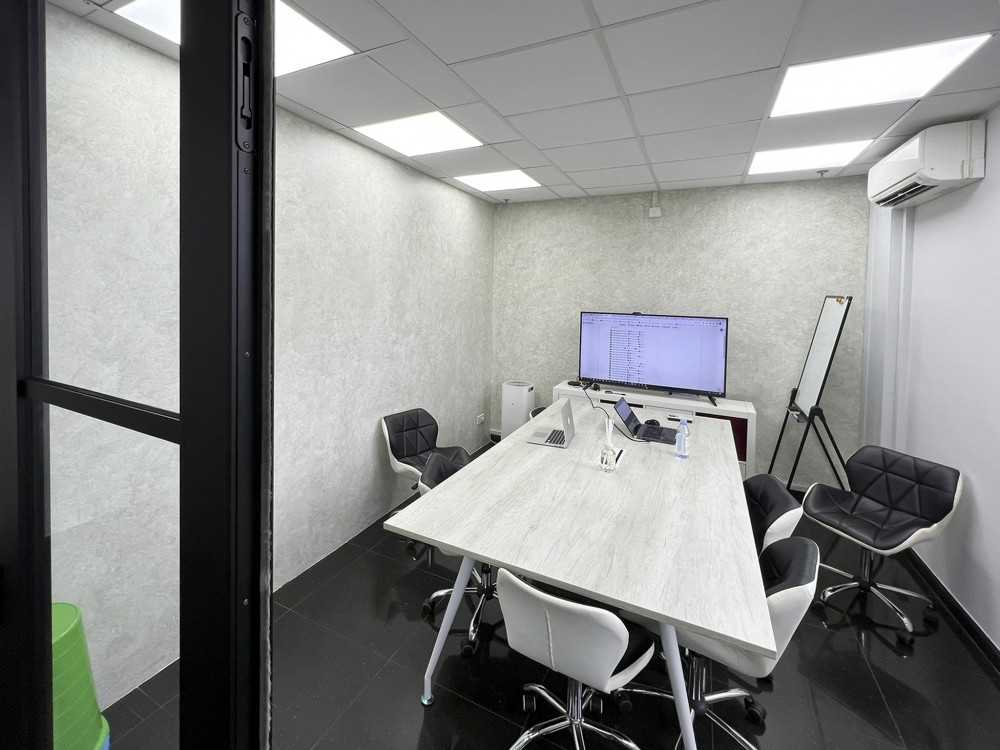 Modern Office with Glass Door and Paintings