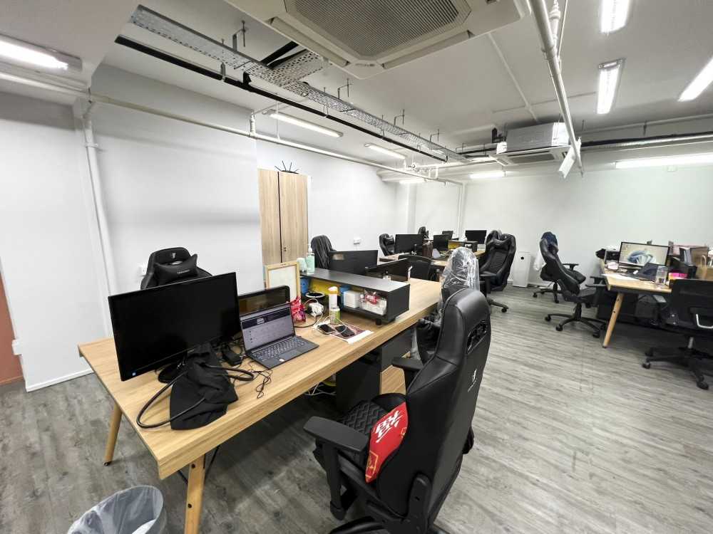 Modern Office with Paintings and Desk Chairs