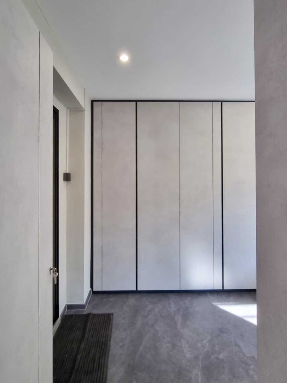 Modern Bedroom with Wardrobe and Paintings