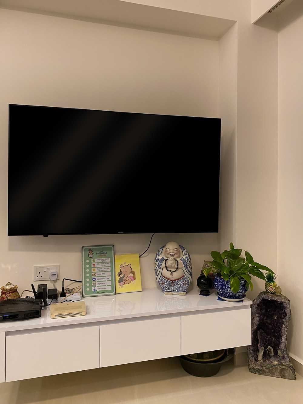 Scandinavian Living Room with TV Console and Paintings
