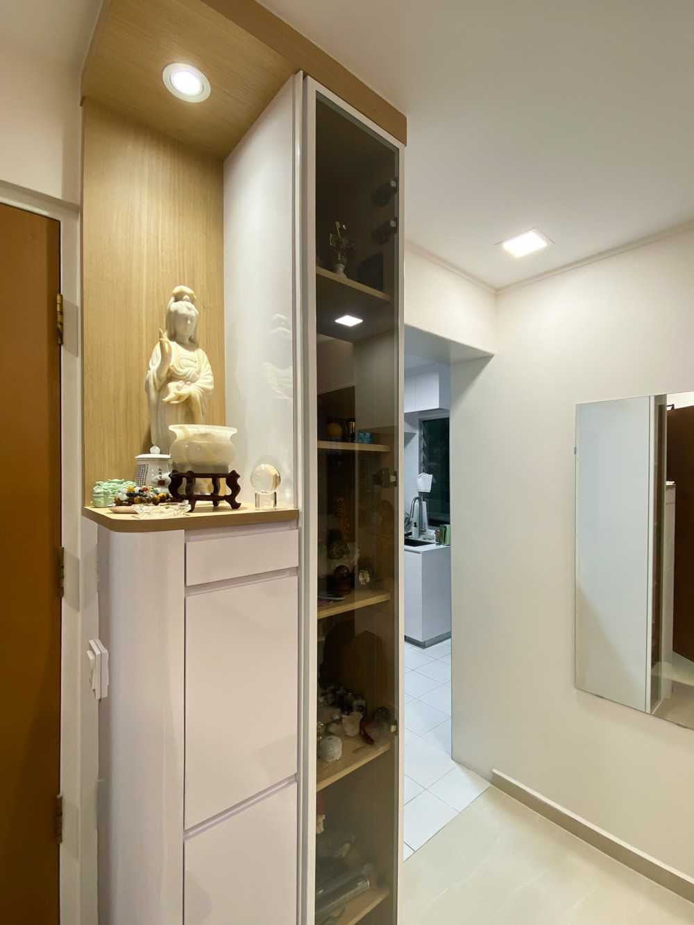 Scandinavian Foyer with Paintings and Storage Cabinets