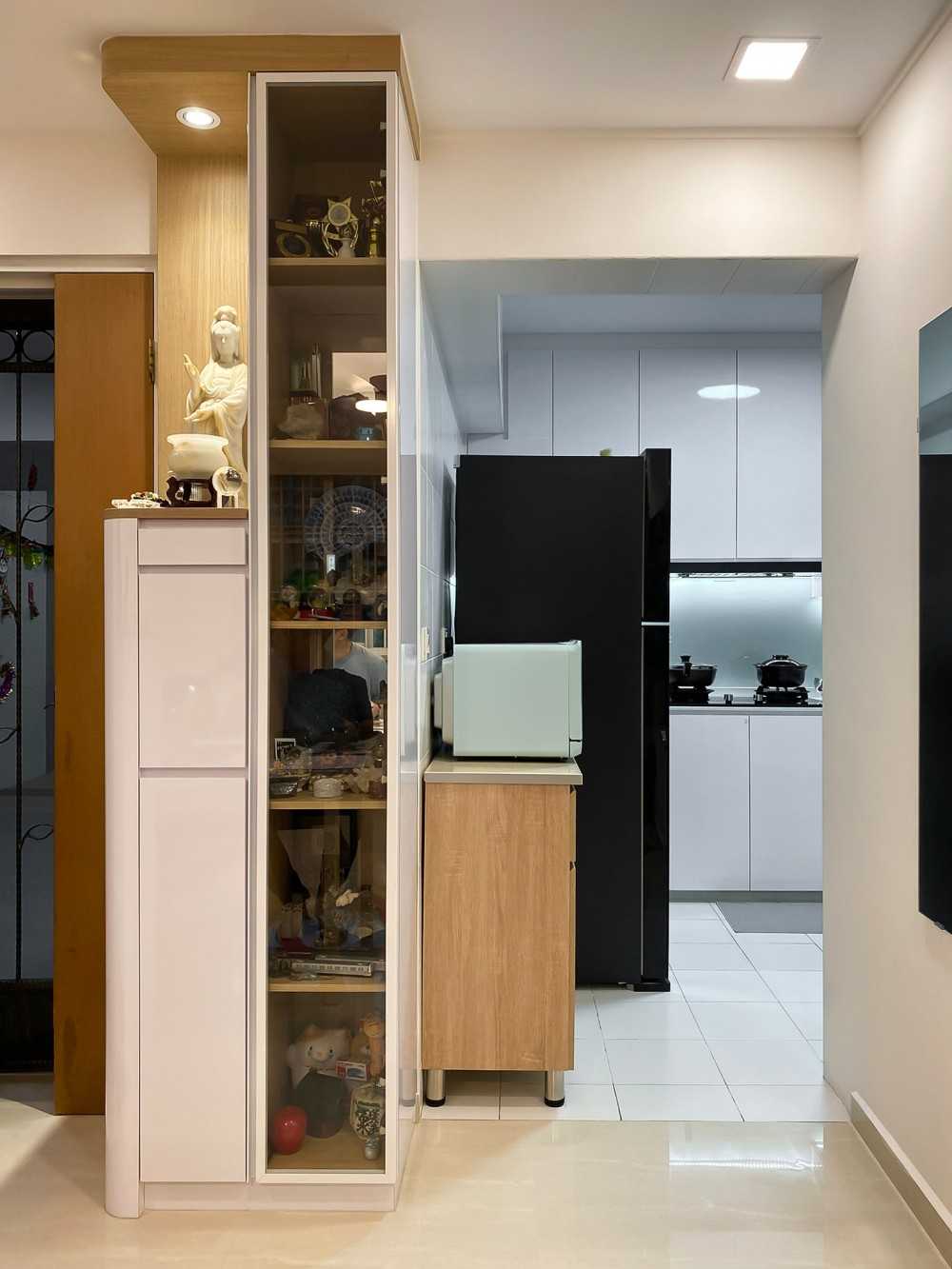Scandinavian Foyer with Paintings and Storage Cabinets