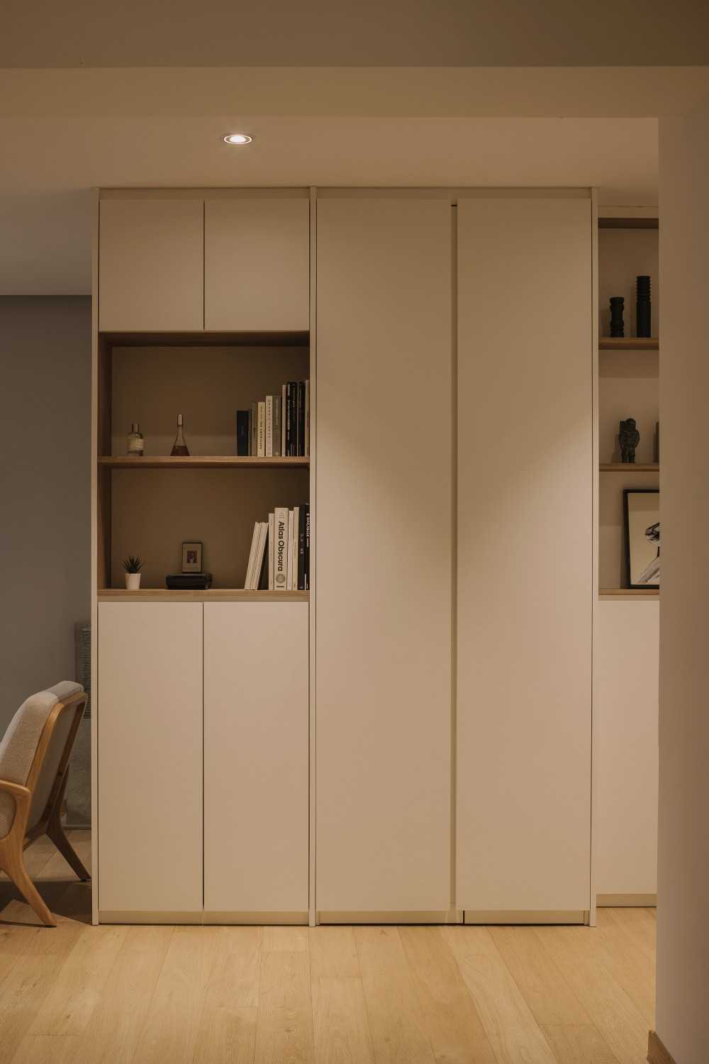 Modern Entryway with Bookshelf and Artwork
