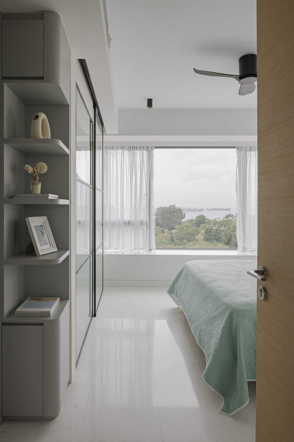 Modern Bedroom with Bay Window and Ceiling Light