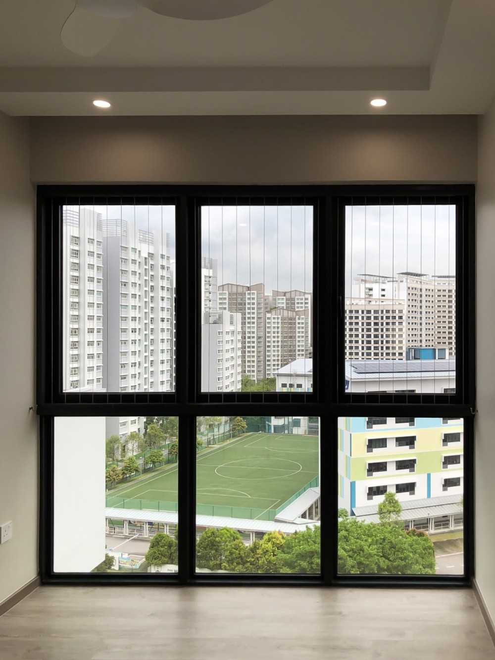 Modern Living Room with Window Grille and Paintings