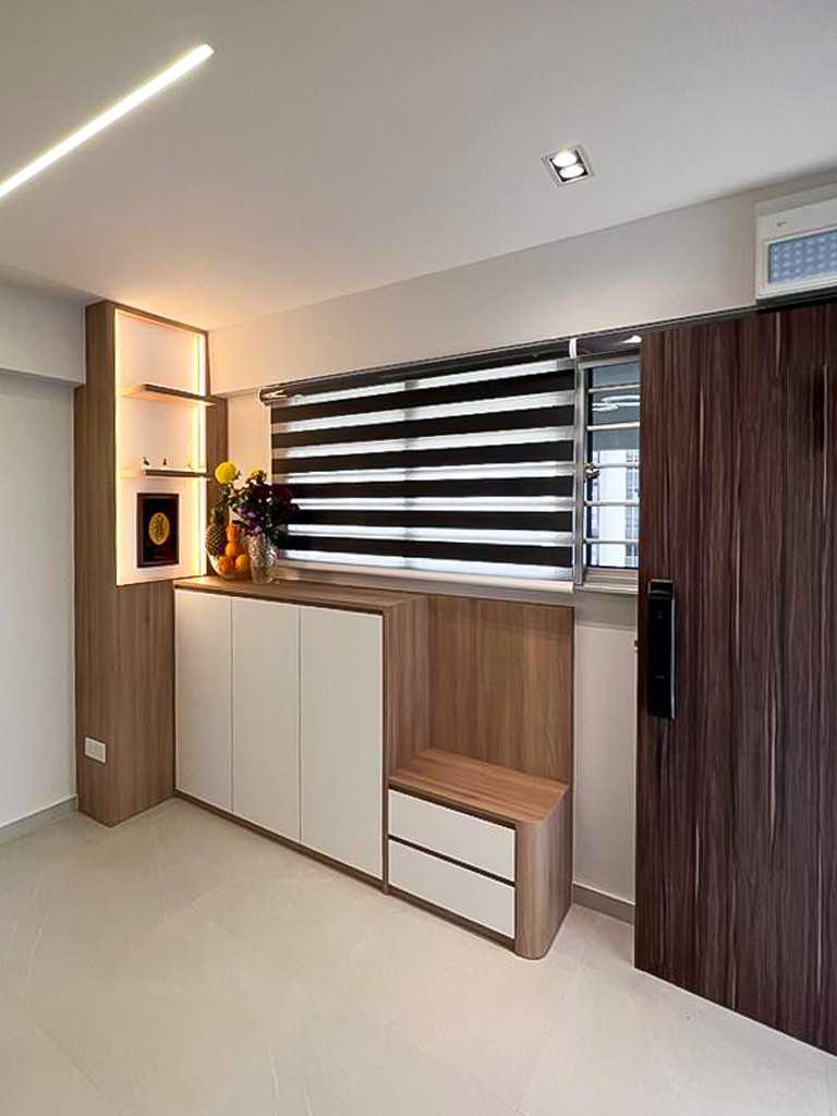 Scandinavian Foyer with Paintings and Storage Cabinets