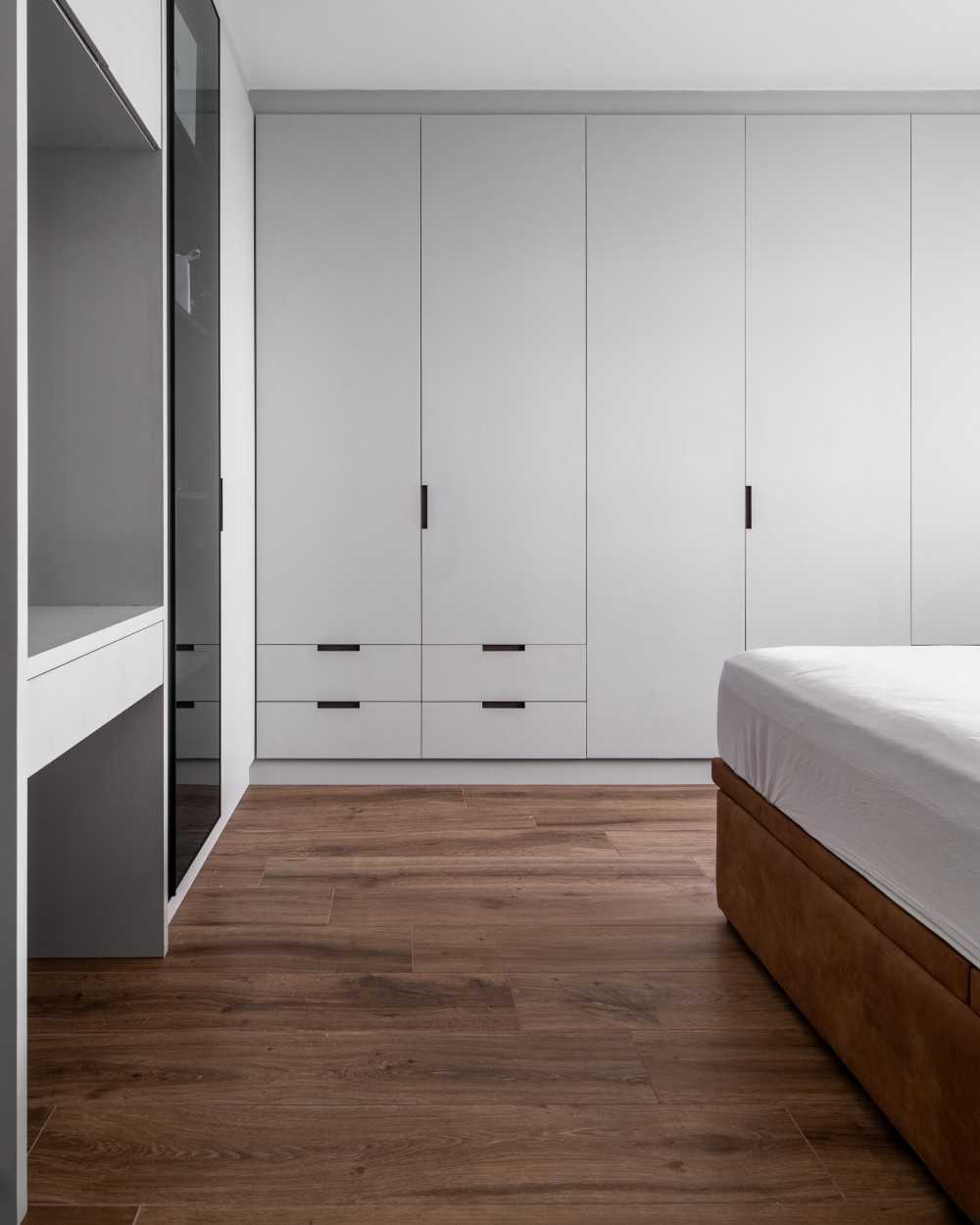 Contemporary Bedroom with Cove Lighting and Wardrobe