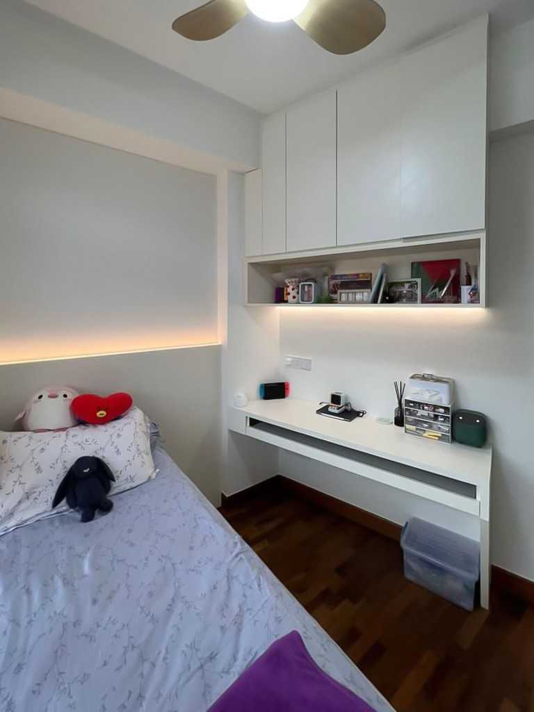 Scandinavian Bedroom with Bookshelf and Paintings