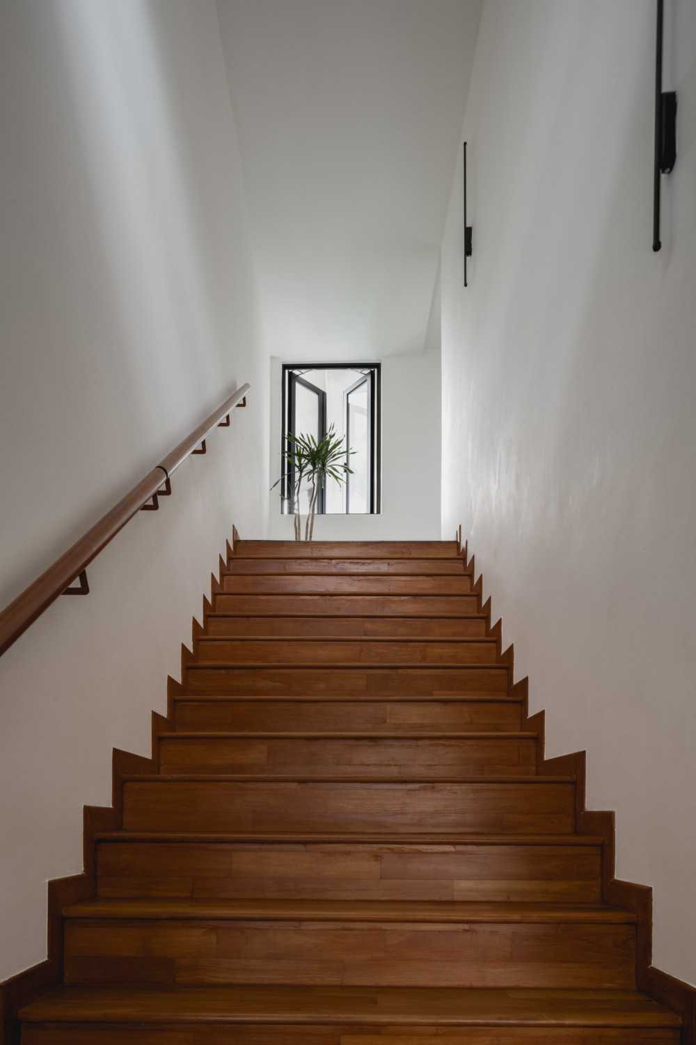 Scandinavian Hallway with Staircase and Window Grille