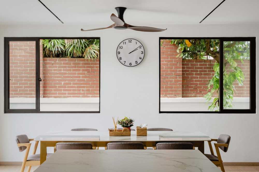 Scandinavian Dining Room with Kitchen Window and Kitchen Island