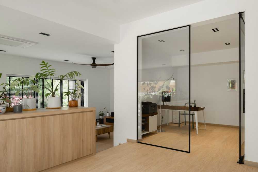 Scandinavian Foyer with Wood Flooring and Desk Chairs