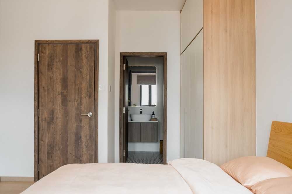 Scandinavian Bedroom with Wood Flooring and Mirror