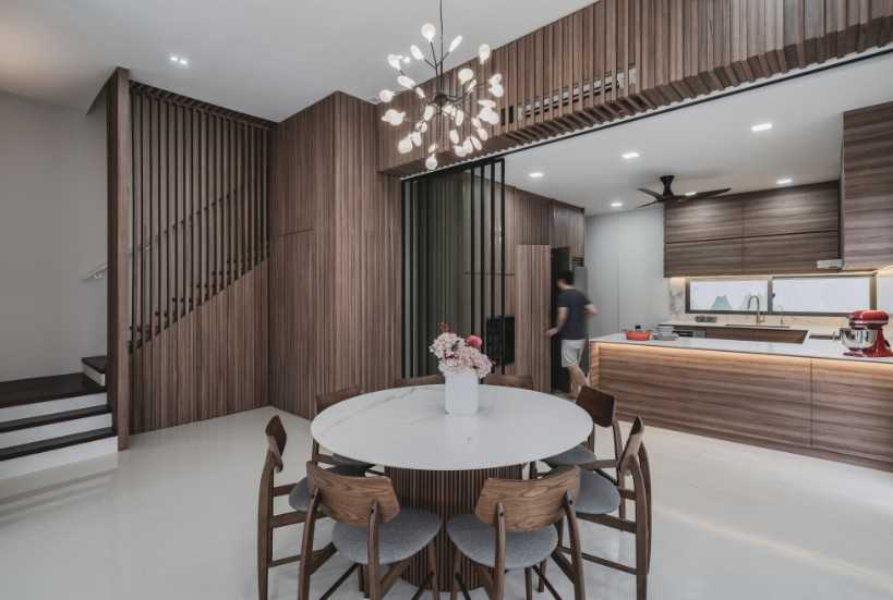 Contemporary Dining Room with Drop Light and Staircase
