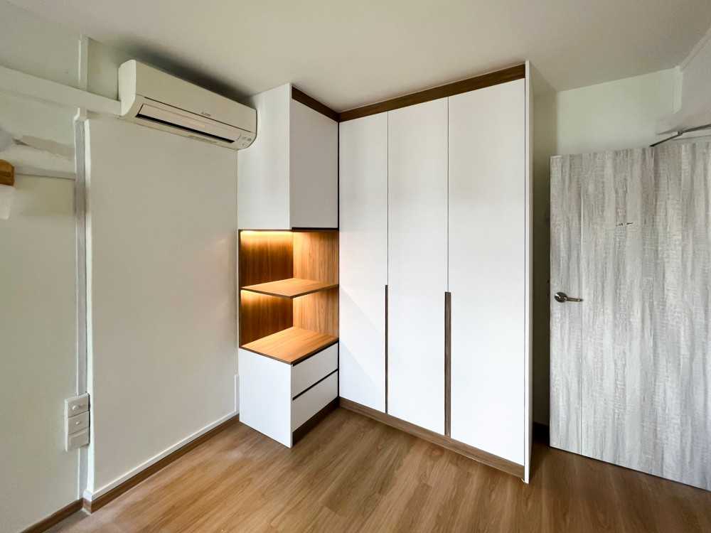 Scandinavian Bedroom with Wardrobe and Paintings