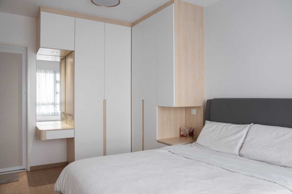Minimalist Bedroom with Wood Flooring and Wardrobe