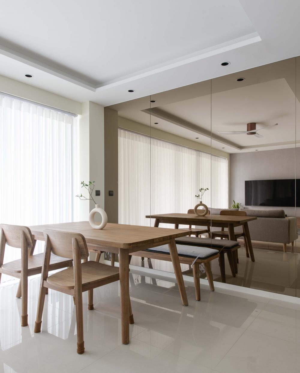 Contemporary Dining Room with Mirror and Cove Lighting