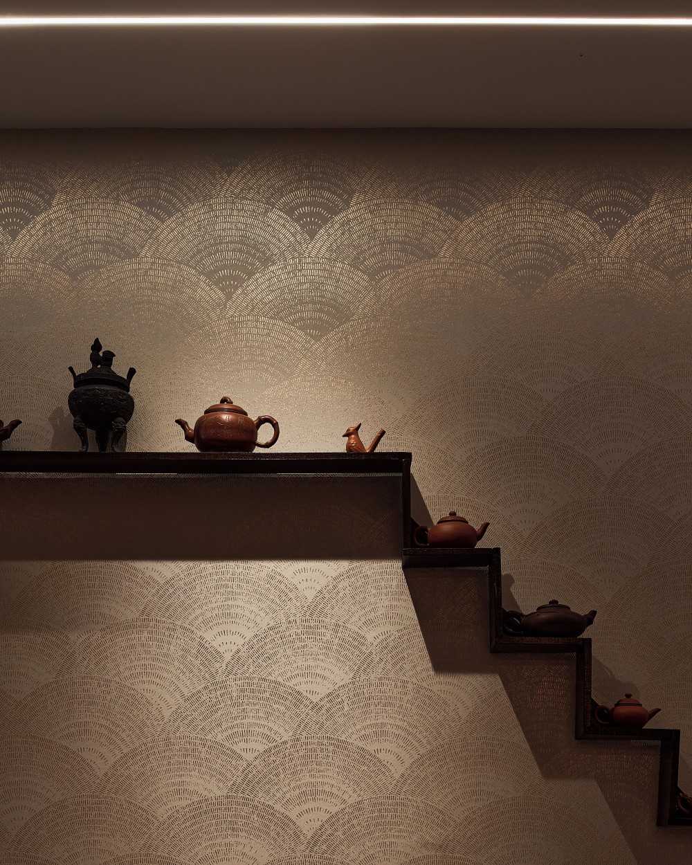 Transitional Foyer with Artwork and Wallpaper