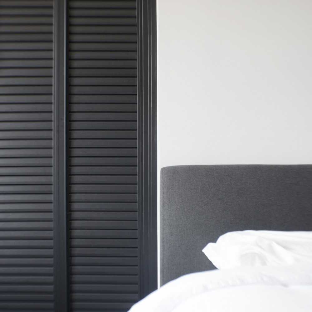 Minimalist Bedroom with Queen Bed and Bed