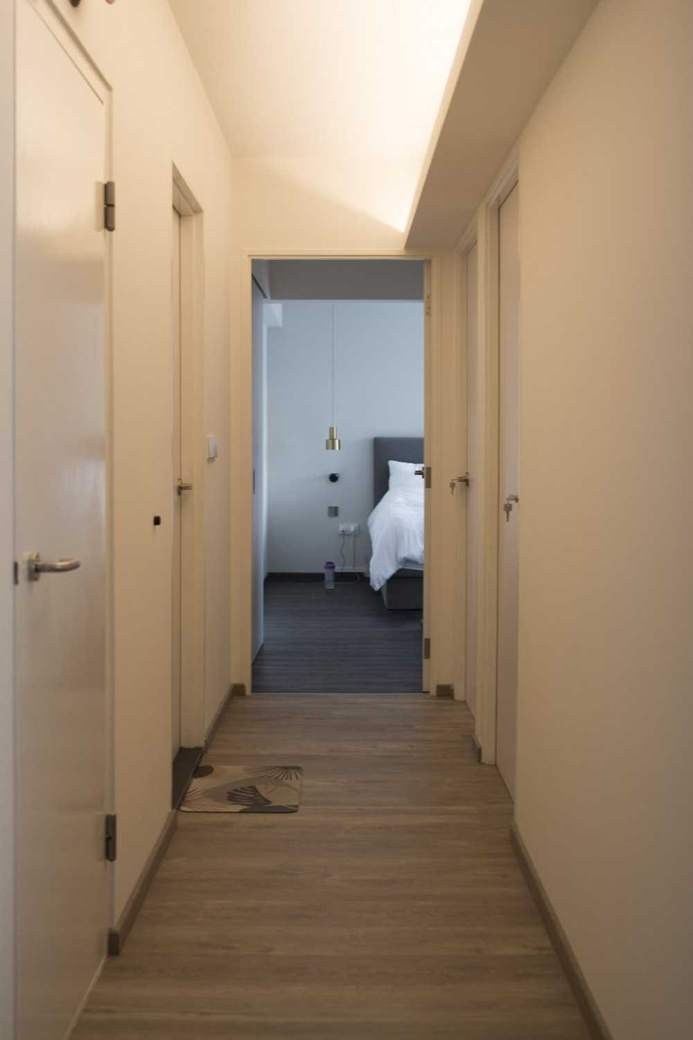 Scandinavian Hallway with Vinyl Flooring and Cove Lighting