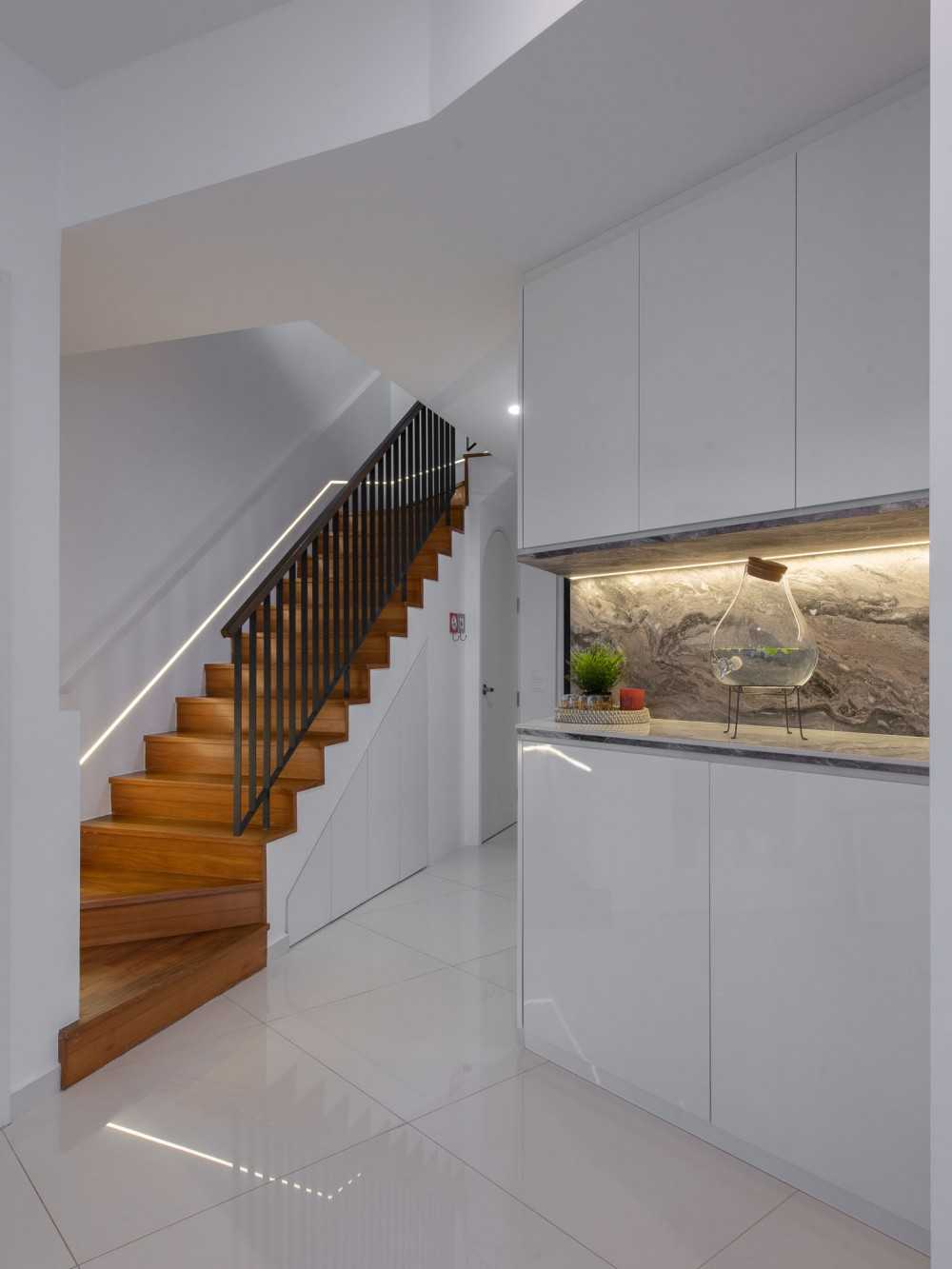 Modern Living Room with Staircase and Storage Cabinets