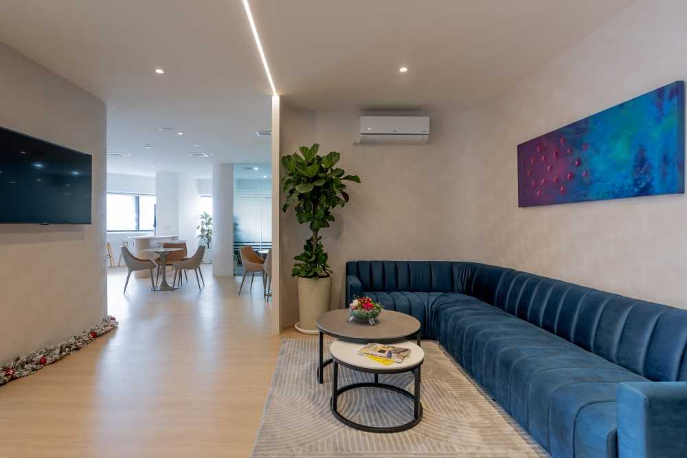 Contemporary Foyer with Artwork and Sofa