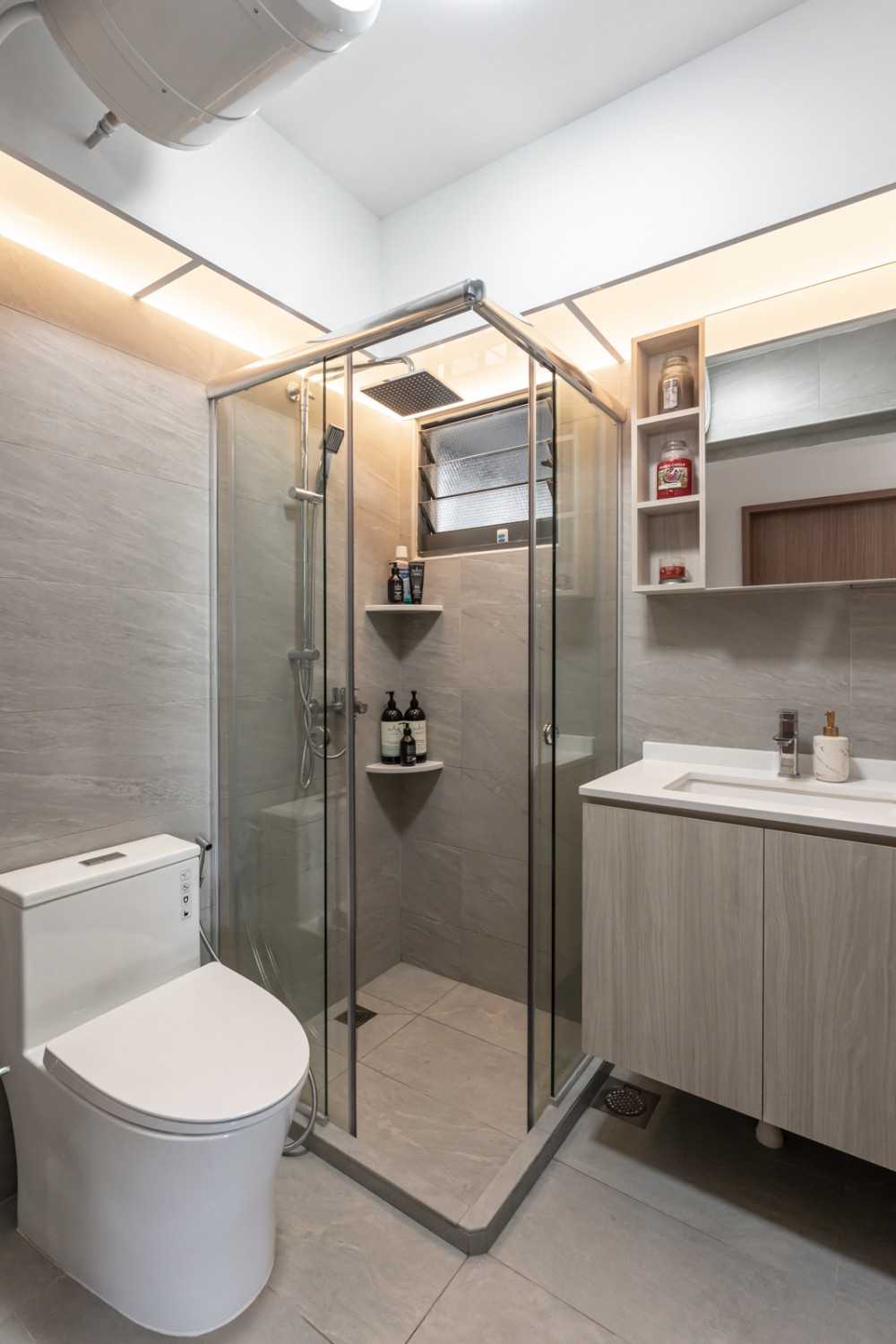Modern Bathroom with Homogeneous Tiles and Rainshower