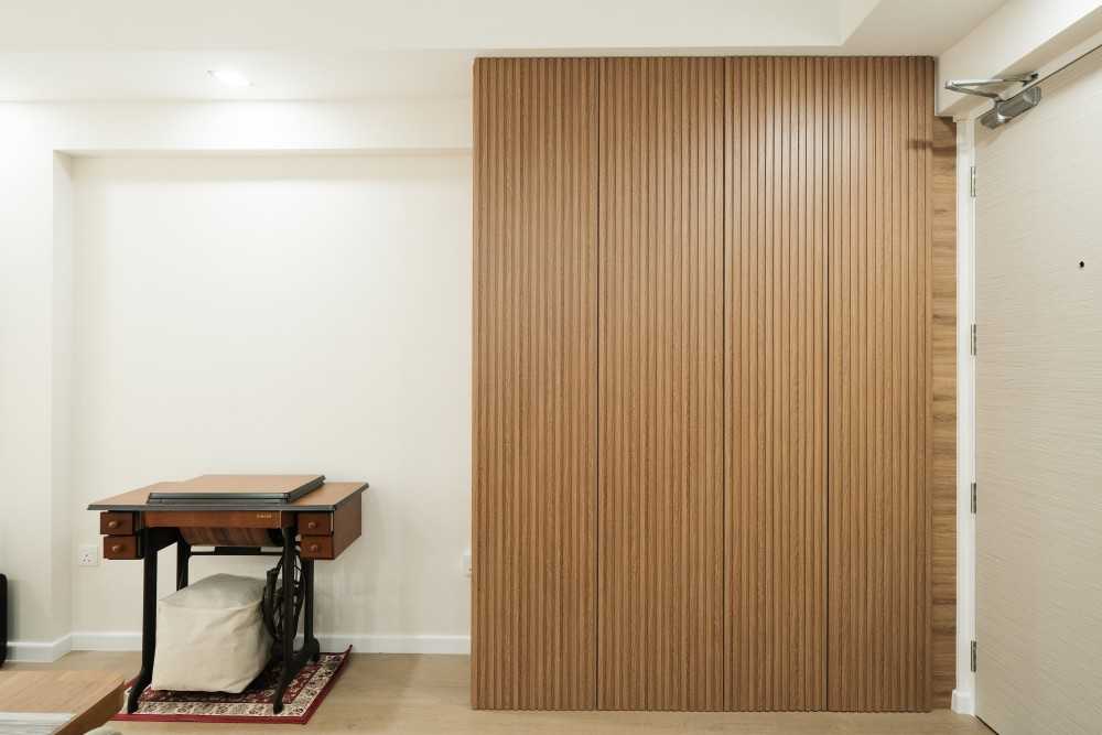 Scandinavian Entryway with Panelling and Shoe Cabinets