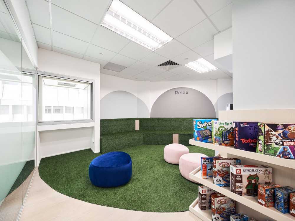 Scandinavian Gaming Room with Sofa and Ottoman