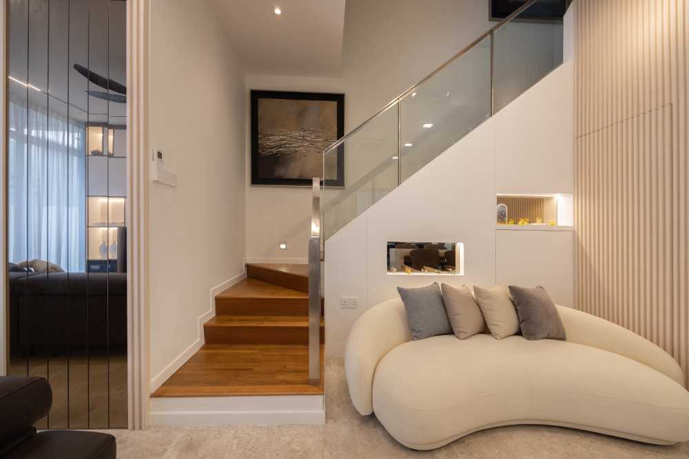 Modern Living Room with Staircase and Panelling