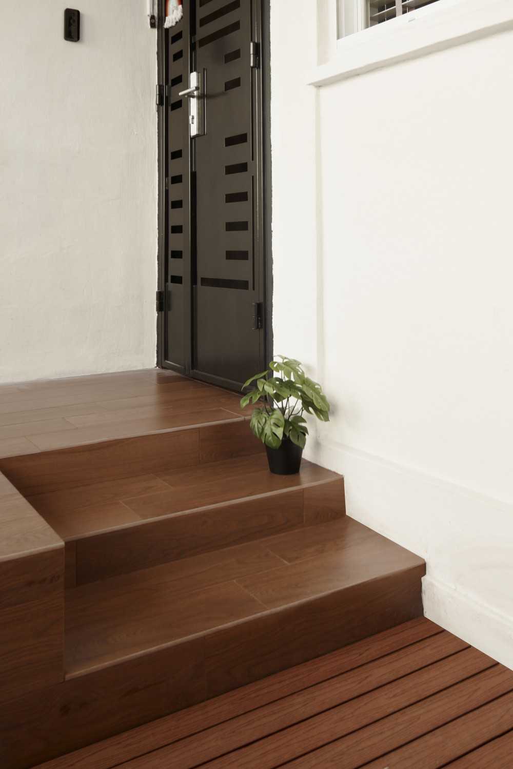 Scandinavian Foyer with Staircase and Planters