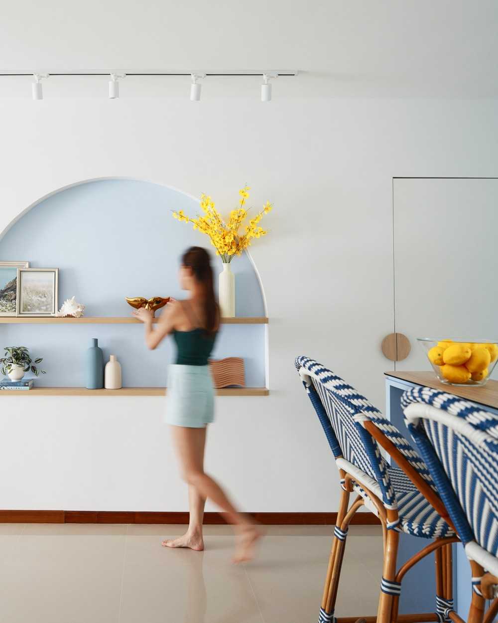 Scandinavian Entryway with Small Storage and Rattan Furniture