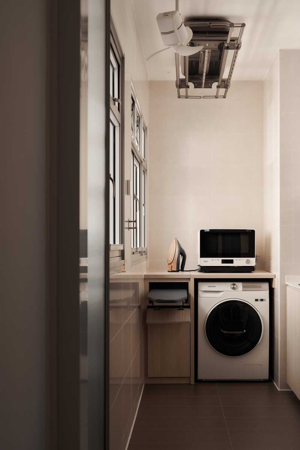 Minimalist Service Yard with Laundry Area and Ironing Board