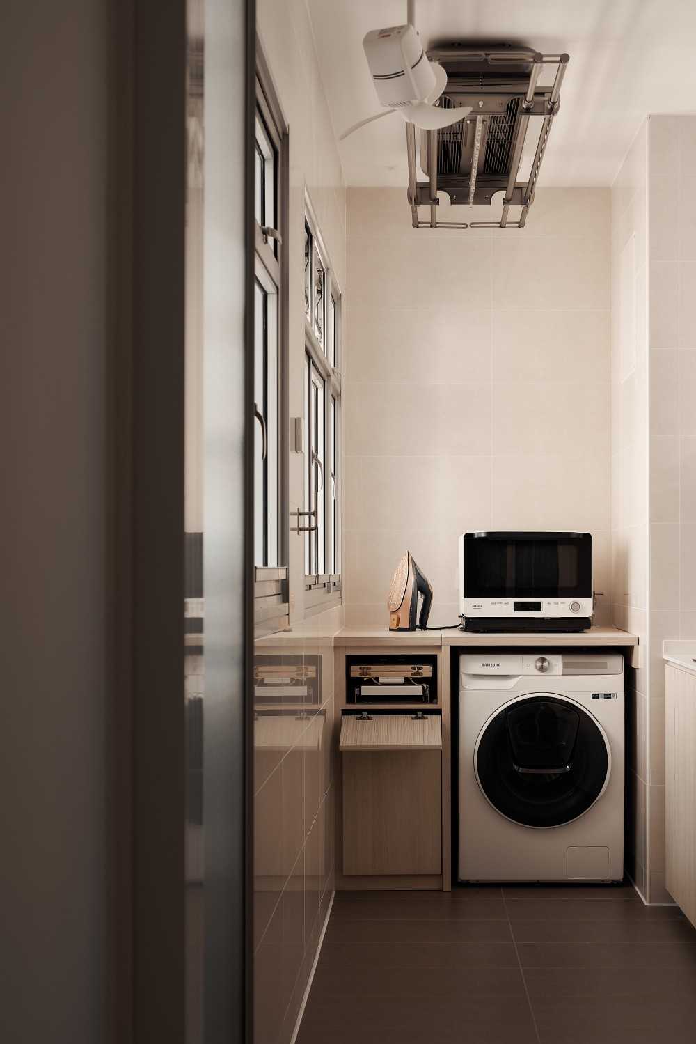 Minimalist Service Yard with Laundry Area and Ironing Board
