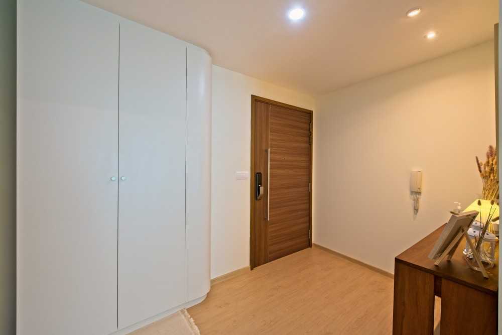 Minimalist Entryway with Storage Cabinets and Doors