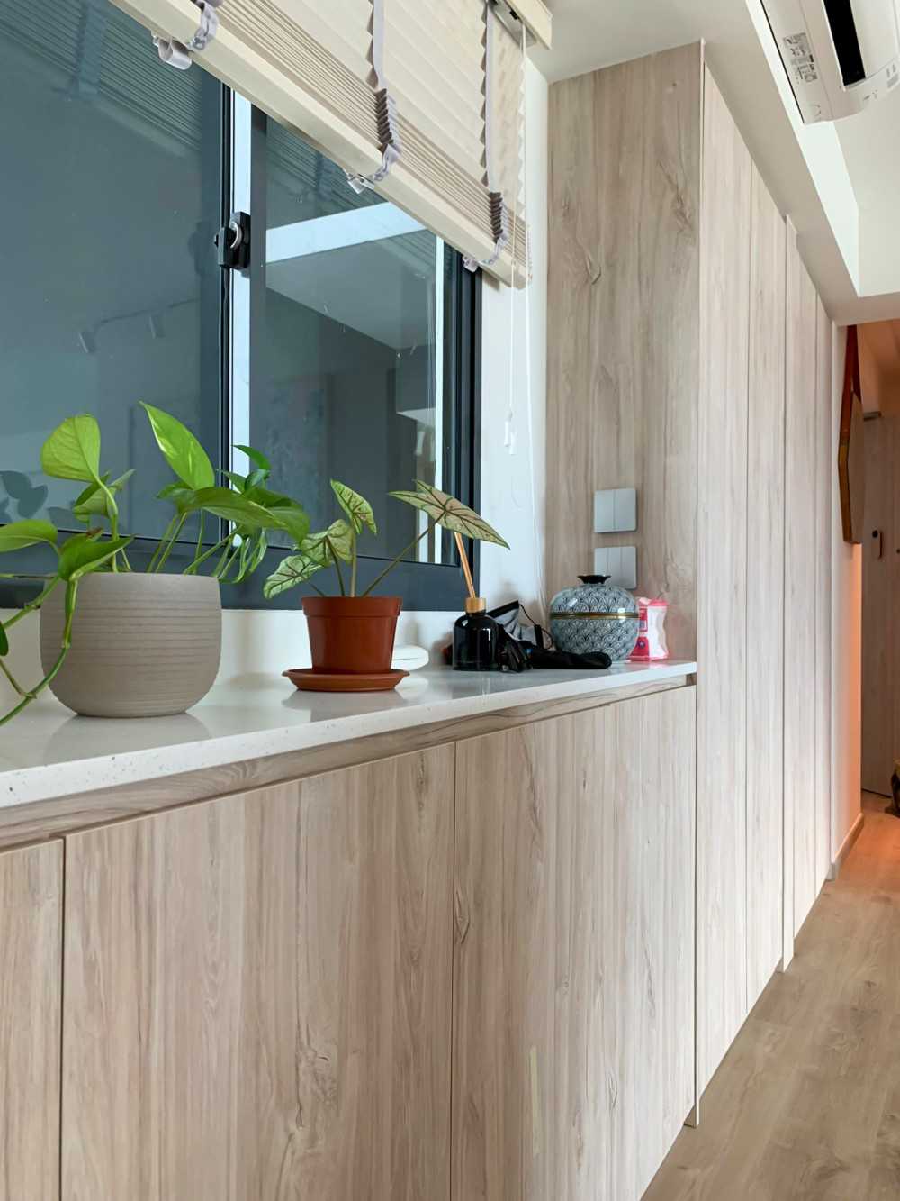 Scandinavian Foyer with Paintings and Storage Cabinets