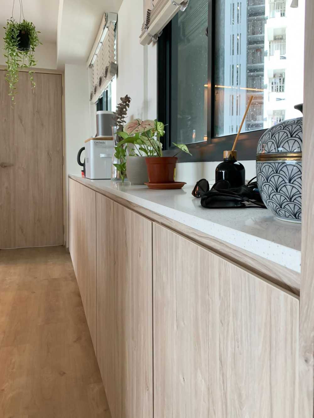 Scandinavian Foyer with Paintings and Storage Cabinets